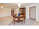 Elegant dining room area with chandelier, with a large window and tile flooring, perfect for Gathering gatherings at 1290 Leeward Rd, Venice, FL 34293