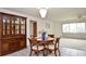 Dining room with hardwood table, china cabinet, and chandelier at 1290 Leeward Rd, Venice, FL 34293