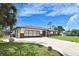 Charming single-story home with well-manicured lawn and attached garage at 1290 Leeward Rd, Venice, FL 34293