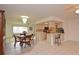 Open-concept kitchen and dining area with tile flooring and modern lighting at 1290 Leeward Rd, Venice, FL 34293