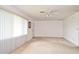 Spacious living room with plush carpeting and natural light at 1290 Leeward Rd, Venice, FL 34293