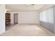 Large living room with neutral carpet and open floor plan at 1290 Leeward Rd, Venice, FL 34293