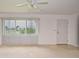 Cozy living room featuring large windows and neutral carpet at 1290 Leeward Rd, Venice, FL 34293