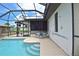 Screened-in pool with patio table and chairs for outdoor relaxation at 1290 Leeward Rd, Venice, FL 34293