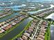 Aerial view of waterfront homes in a beautiful community with lush landscaping and serene lakes at 13862 Miranese St, Venice, FL 34293