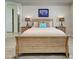 A cozy bedroom with rustic wood furniture at 13862 Miranese St, Venice, FL 34293