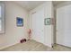 Neutral bedroom featuring a closet with sliding doors, tile flooring, and simple artwork at 13862 Miranese St, Venice, FL 34293