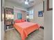 Cozy bedroom featuring a built-in Murphy bed, shelving, and a shuttered window at 13862 Miranese St, Venice, FL 34293