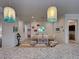 Open dining room with beach themed decorations and decorative lighting at 13862 Miranese St, Venice, FL 34293