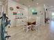Dining room featuring a wooden table, coastal decor, and decorative lighting at 13862 Miranese St, Venice, FL 34293