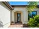Inviting front entrance with decorative door, brick walkway, and manicured landscaping at 13862 Miranese St, Venice, FL 34293