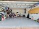 Spacious garage with epoxy flooring and ample storage for bikes, tools, and outdoor gear at 13862 Miranese St, Venice, FL 34293