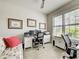 Home office features a computer desk, built in cabinets, a wicker couch and plantation shutters at 13862 Miranese St, Venice, FL 34293