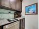 Kitchen with granite countertops and plenty of wine storage space at 13862 Miranese St, Venice, FL 34293