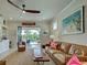 Living room with fan and view of pool at 13862 Miranese St, Venice, FL 34293