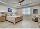 Serene bedroom with natural light, neutral tones, and stylish furnishings at 13862 Miranese St, Venice, FL 34293