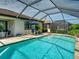 Inviting screened-in pool with crystal clear water and comfortable poolside seating at 13862 Miranese St, Venice, FL 34293