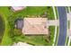Aerial view of the property showcasing the home's tile roof and landscaped yard at 2396 Caraway Dr, Venice, FL 34292