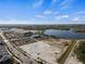 Community aerial with lake views, open land, commercial areas, and new construction homes at 2396 Caraway Dr, Venice, FL 34292