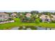 This backyard is a lush tropical oasis, complete with water views, palm trees, and plenty of room to relax at 2396 Caraway Dr, Venice, FL 34292