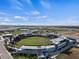Aerial view of the modern baseball stadium on a sunny day with clear blue skies at 2396 Caraway Dr, Venice, FL 34292