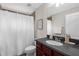Practical bathroom featuring a shower with a curtain, vanity with a sink, and neutral wall colors at 2396 Caraway Dr, Venice, FL 34292