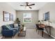 Comfortable bedroom with a ceiling fan, sofa, desk, neutral walls and plush carpet at 2396 Caraway Dr, Venice, FL 34292