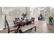 Dining area with a full dining set and view into the living room at 2396 Caraway Dr, Venice, FL 34292