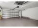 Spacious two car garage with an automatic door and painted concrete floor at 2396 Caraway Dr, Venice, FL 34292
