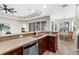 Beautiful kitchen showcasing a breakfast bar, open layout, and connection to the living area at 2396 Caraway Dr, Venice, FL 34292