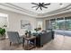 Inviting living room with plush seating, accent pillows, and a view of the outdoor patio at 2396 Caraway Dr, Venice, FL 34292