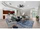 Inviting living room with an open floor plan connecting the kitchen and dining areas at 2396 Caraway Dr, Venice, FL 34292