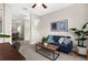 Inviting living area featuring a blue sofa, wood coffee table, with neutral walls and carpeted flooring at 2396 Caraway Dr, Venice, FL 34292