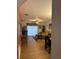 Living room features light wood floors, a brown couch and coffee table at 3310 Loveland Blvd # 1406, Punta Gorda, FL 33980