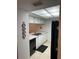 Kitchen with black appliances and white cabinets at 3310 Loveland Blvd # 1406, Punta Gorda, FL 33980