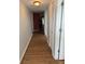 Long hallway with wood-look floors at 3310 Loveland Blvd # 1406, Punta Gorda, FL 33980
