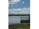 Tranquil lake view with a dock at 3310 Loveland Blvd # 1406, Punta Gorda, FL 33980