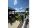 Community pool with a patio and lake view at 3310 Loveland Blvd # 1406, Punta Gorda, FL 33980