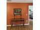 Living room with decorative console table at 3310 Loveland Blvd # 1406, Punta Gorda, FL 33980
