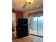 Living room with water view, fireplace, and sliding glass door to balcony at 3310 Loveland Blvd # 1406, Punta Gorda, FL 33980