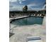 Inviting community swimming pool with lounge chairs at 3310 Loveland Blvd # 1406, Punta Gorda, FL 33980