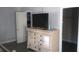 Bedroom with dresser, TV, and two closets at 18245 Ackerman Ave, Port Charlotte, FL 33948