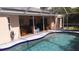 Relaxing pool area with covered patio and seating at 18245 Ackerman Ave, Port Charlotte, FL 33948