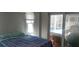 Bedroom with pool view and sliding glass doors at 18245 Ackerman Ave, Port Charlotte, FL 33948