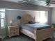 Main bedroom with wood flooring and ensuite bathroom at 18245 Ackerman Ave, Port Charlotte, FL 33948
