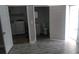 Bathroom and laundry area with gray flooring at 18245 Ackerman Ave, Port Charlotte, FL 33948