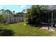 Spacious backyard, storage sheds, and a glimpse of the pool at 18245 Ackerman Ave, Port Charlotte, FL 33948