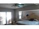 Spacious bedroom with ceiling fan and backyard access at 18245 Ackerman Ave, Port Charlotte, FL 33948