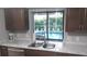 Kitchen with stainless steel appliances and pool view at 18245 Ackerman Ave, Port Charlotte, FL 33948