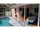 Enjoy this covered patio overlooking the pool at 18245 Ackerman Ave, Port Charlotte, FL 33948